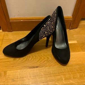 Black heels with silver and gold studs on back